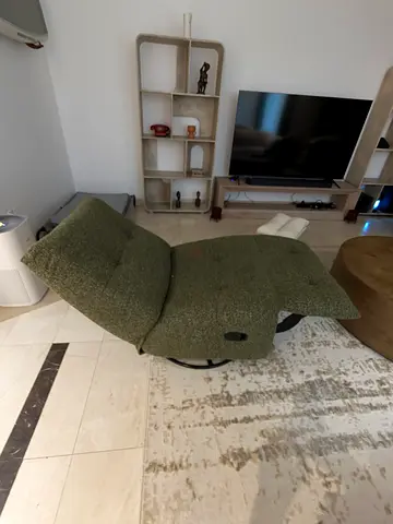 Green swivel lounge chair with ottoman - gently used (Lazy Boy)