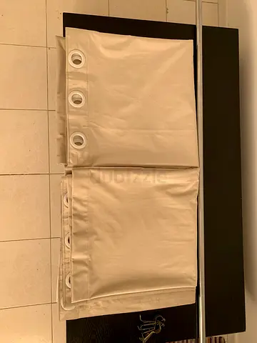 Beige eyelet curtains (pair) — good condition, ready to hang