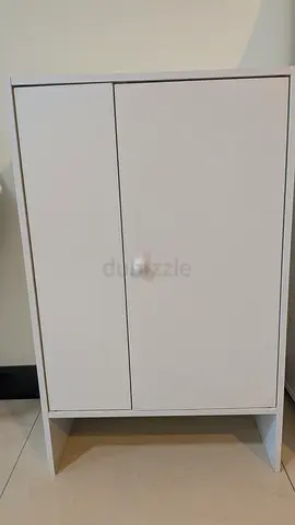 Compact white storage cabinet with doors - good condition