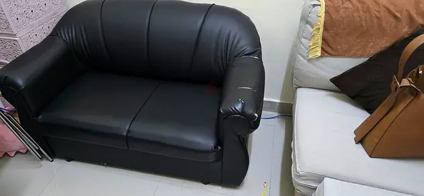 Black 2-seater faux leather sofa — good for small living room