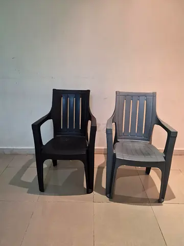 Set of 2 sturdy plastic outdoor chairs — good used condition