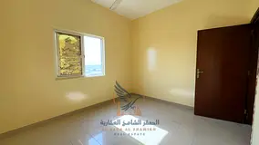 Two-bedroom apartment with a living room and balcony, behind Emirates Markets, prime location for an