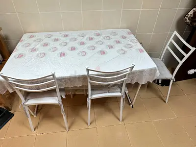Used white dining table with 4 chairs