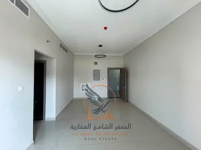 Two-bedroom apartment with a living room for annual rent in Ajman, Al Rashidiya 1 area. It is brand new and has never been occupied.