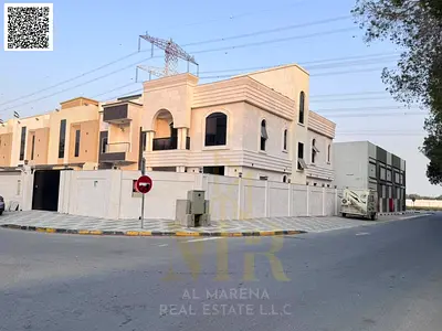 A corner villa in the Al Yasmeen area of ​​Ajman, boasting a prime location and a high level of pri