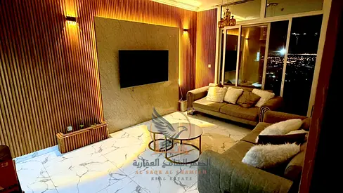 Furnished two-bedroom apartment with a living room, sea view, gym, swimming pool, and private parking. Clean and tidy furnishings.