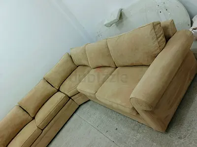Neat and clean pottery barn beige color corner sofa