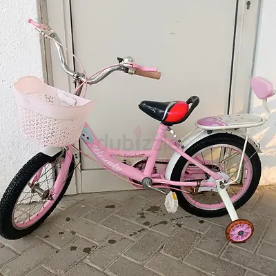 Pink kids' 16-inch bicycle with training wheels and basket for 5 to 8 years old kids