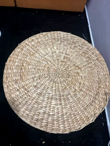 Round woven seagrass floor cushion / pouf