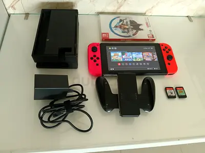 Nintendo Switch 2 console (Neon) with dock, charger, grip and 2 games