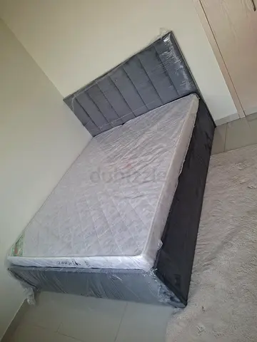 Brand new queen mattress with upholstered headboard - still wrapped