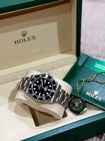 Rolex Submariner stainless steel automatic watch with box and papers fresh date