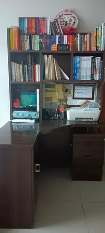 Study desk with bookshelf and assorted books (collection)