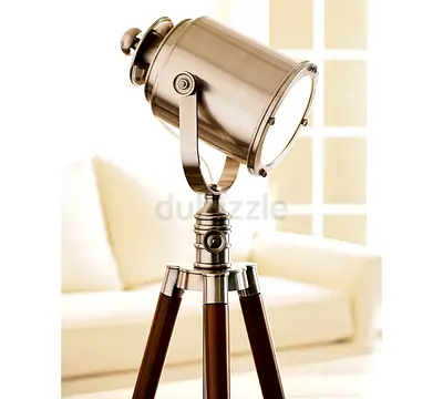 Vintage-style tripod floor lamp with metal spotlight head from Pottery Barn