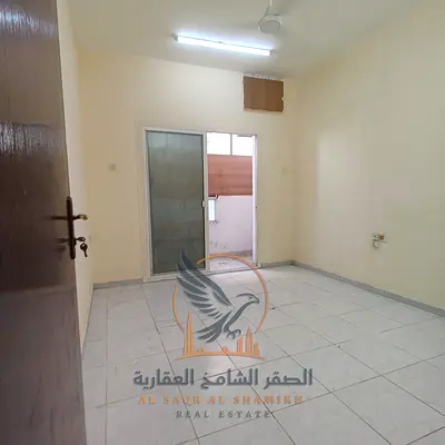 One-bedroom apartment for annual rent in Ajman's Al Nakheel district. Features a separate living room and a practical design.