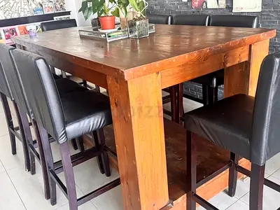 Solid Wood Dining Table with 8 High-Back Leather Chairs – AED 650