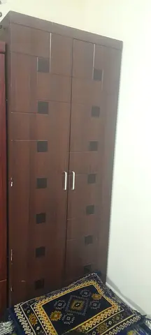 Two-door wooden wardrobe in good condition