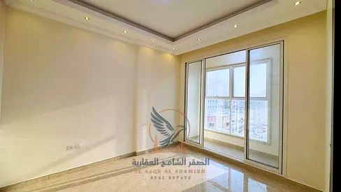 For annual rent in Ajman: a two-bedroom apartment with a living room, very high-end finishes, and a private parking space.