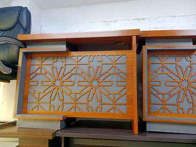 Pair of wooden bedside cabinets with decorative laser-cut fronts
