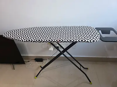 Standard ironing board with patterned cover, foldable and sturdy