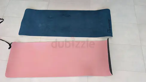 Two yoga mats — non-slip exercise mats, good condition.