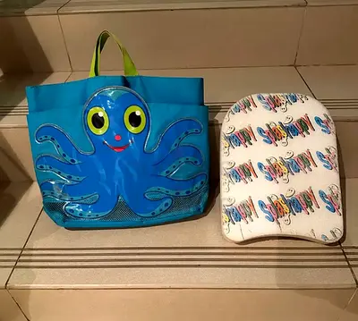 Infant swim bag and splash board