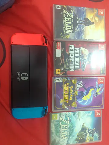 Nintendo Switch console with 4 games