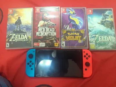 Nintendo Switch console with 4 games