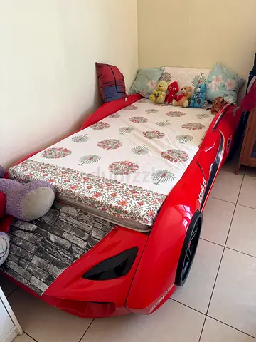 Red Race Car Kids Bed - Single Size, Good Condition. Without matress or anything shown on the bed.