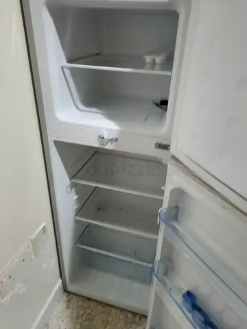 Used single-door fridge with top freezer - good working condition