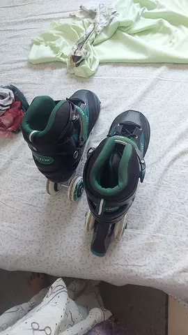 Child's adjustable inline skates - size adjustable, Excellent condition with free toys