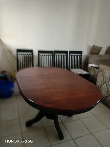 Solid wood oval dining table with 4 chairs - good condition