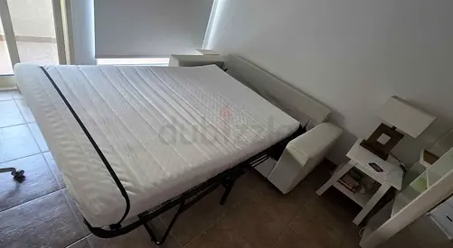 White pull-out sofa bed with mattress - good condition