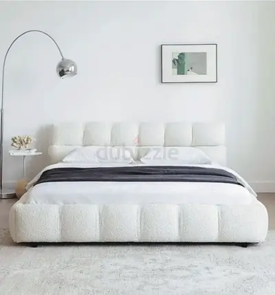 White upholstered platform bed with padded headboard,king