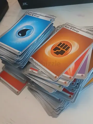 Bulk lot of Pokémon energy and trainer cards (used)
