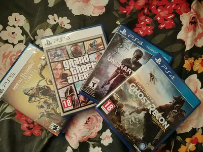 Collection of PlayStation 4 & PS5 games — 4 titles (GTA V, Uncharted, Ghost Recon, Mortal Kombat)