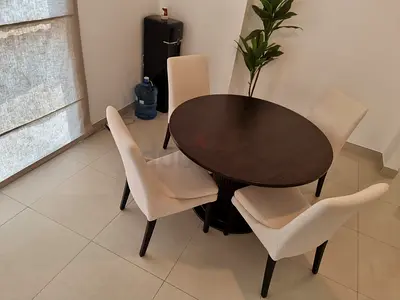 Dark Wood Round Dining Table with 4 Cream Upholstered Chairs