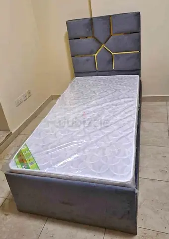 Single grey upholstered bed frame with mattress - good condition