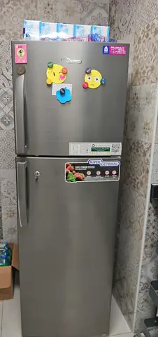 Silver double-door refrigerator in good working condition