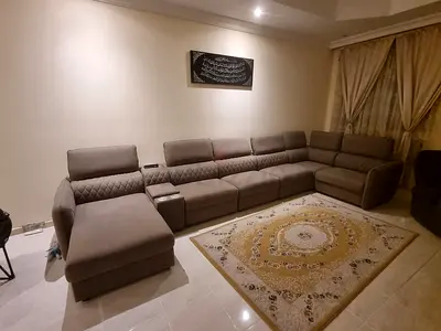 Large L-shaped fabric sectional sofa in beige, good condition