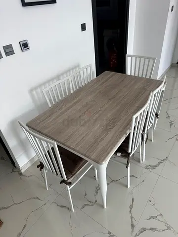6-piece dining table set with wooden top and white metal chairs