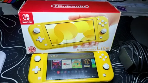 Yellow Nintendo Switch Lite with original box and charger - good condition (lines on screen)