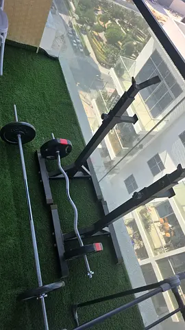 Barbell, curved barbell with weights 2x5kg, 2x10kg, plus stands