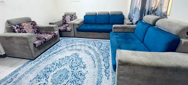Used 3-piece sofa set with armchairs and blue patterned rug - good condition