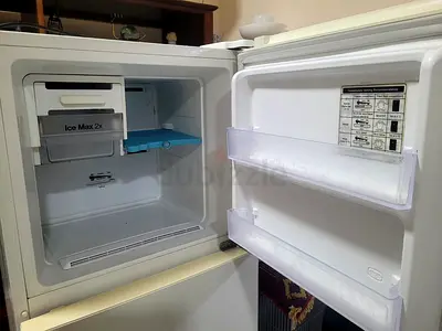 Compact white top-freezer refrigerator in good working condition