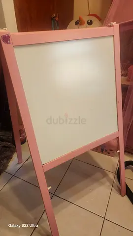 Pink double-sided kids easel with whiteboard and chalkboard