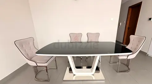 Modern glass-top dining table with 4 upholstered chairs pls don’t waste your time or mine for low
