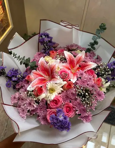 Fresh mixed floral bouquet with lilies, roses and chrysanthemums