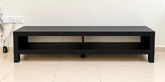Black low TV stand / entertainment unit with shelf - Excellent condition - Unused.