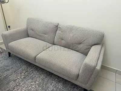 Light grey 2 seater fabric sofa in good condition